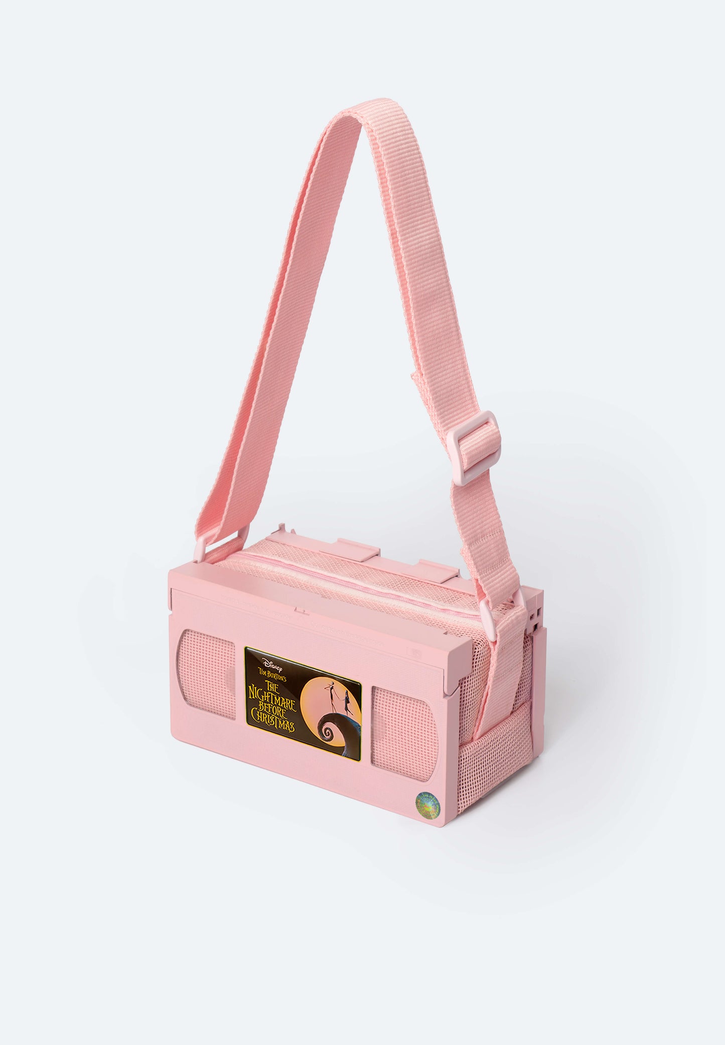 Pink VHS Bag Customized with the Nightmare Before Christmas inspired magnet, collectible Movie Charm for VHS bags, a tribute to Tim Burton’s spooky holiday classic