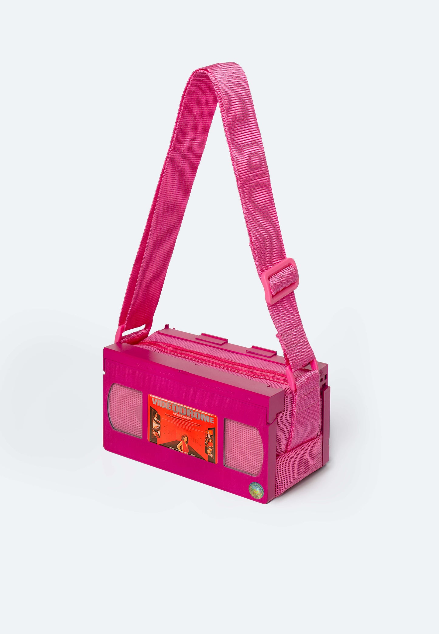 Fuchsia VHS bag customized with Videodrome movie charm Handmade upcycled accessory with magnetic film collectible by Pepita Chiringo