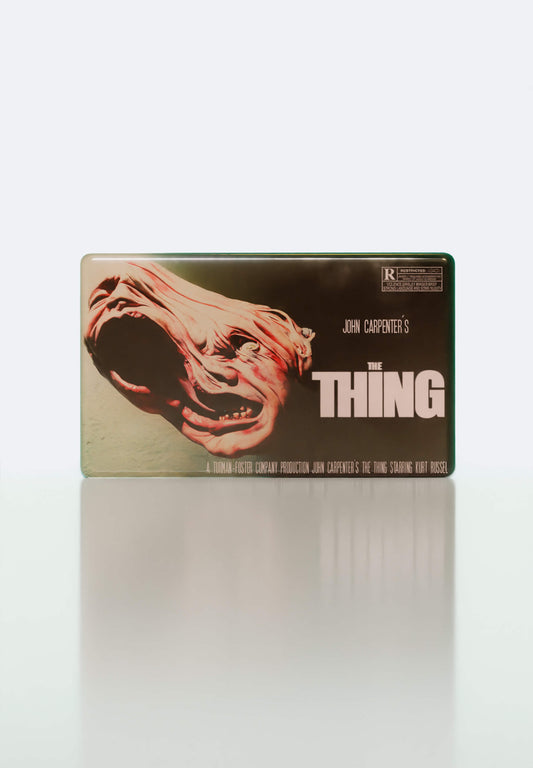 The Thing inspired magnet, collectible Movie Charm for VHS bags, a nod to John Carpenter’s chilling sci-fi horror classic from the 80s